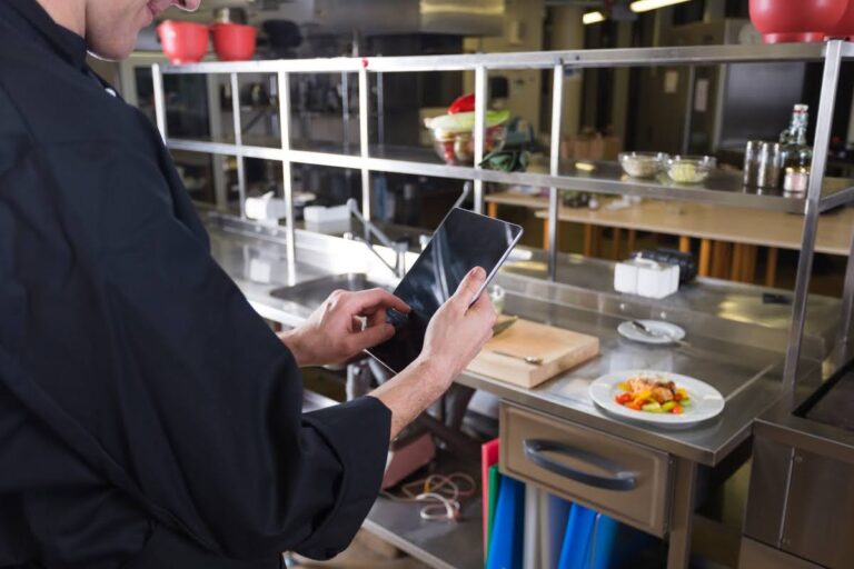 Chef checking LA codes for kitchen ventilation.
