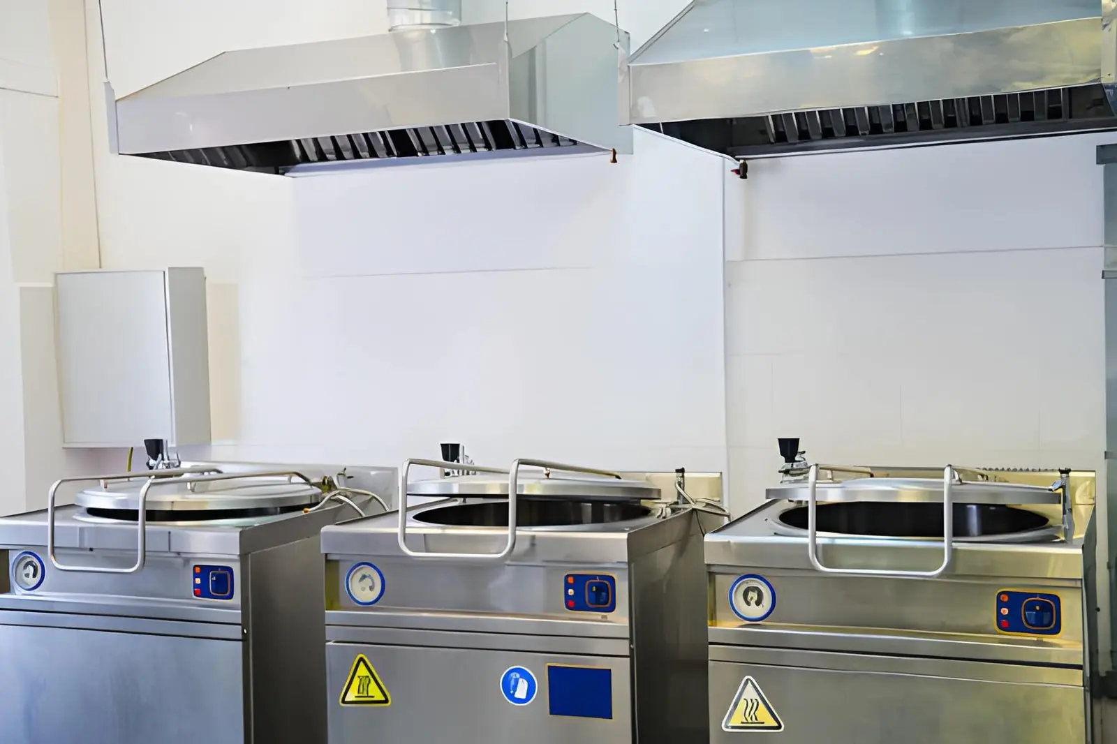 Commercial Kitchen Hood Installation showing modern stainless steel ventilation system in professional kitchen setup