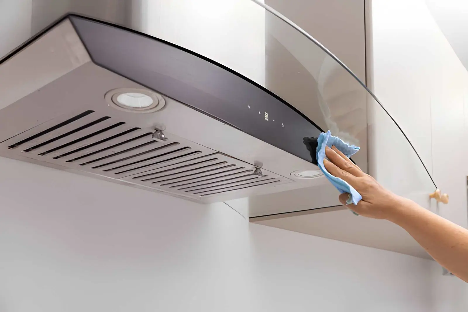 Commercial Hood Fan Repair technicians inspecting commercial kitchen ventilation system components closely