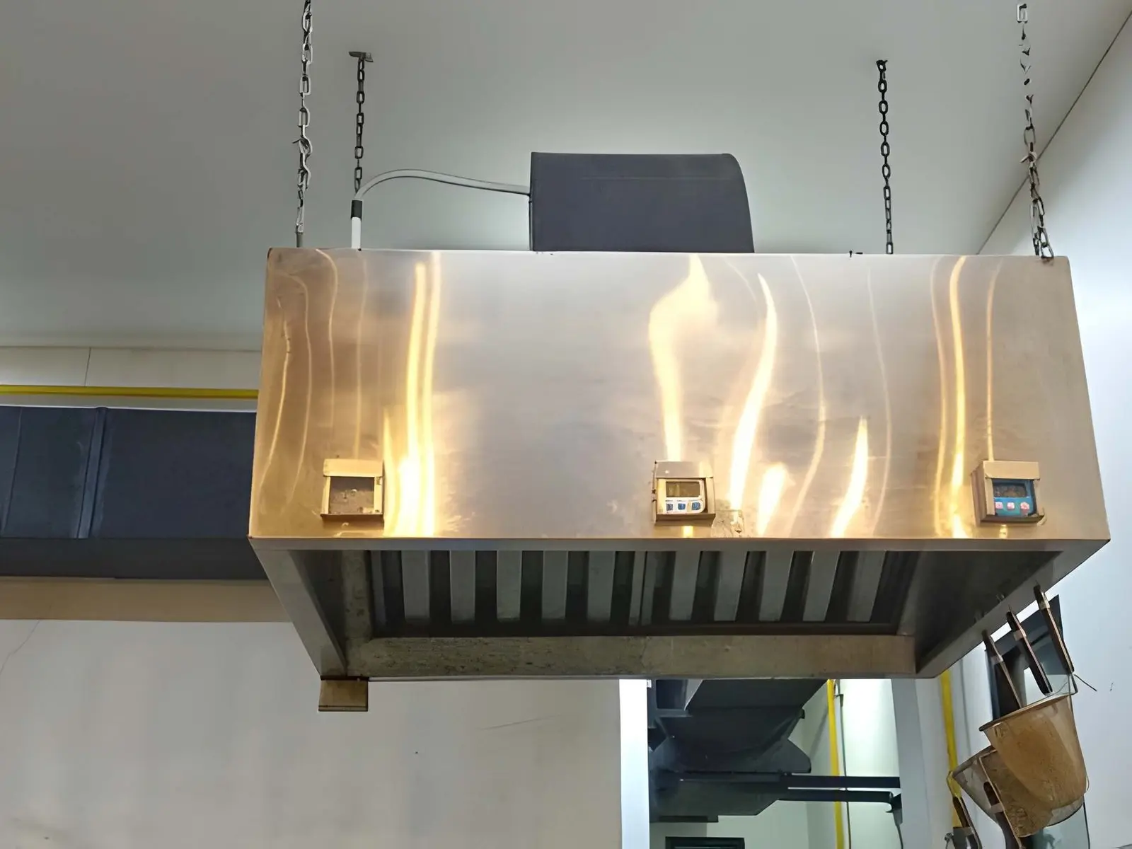 Commercial Hood Kitchen Repair and Installation in Canoga Park showing professional hood installation in a busy restaurant kitchen setup