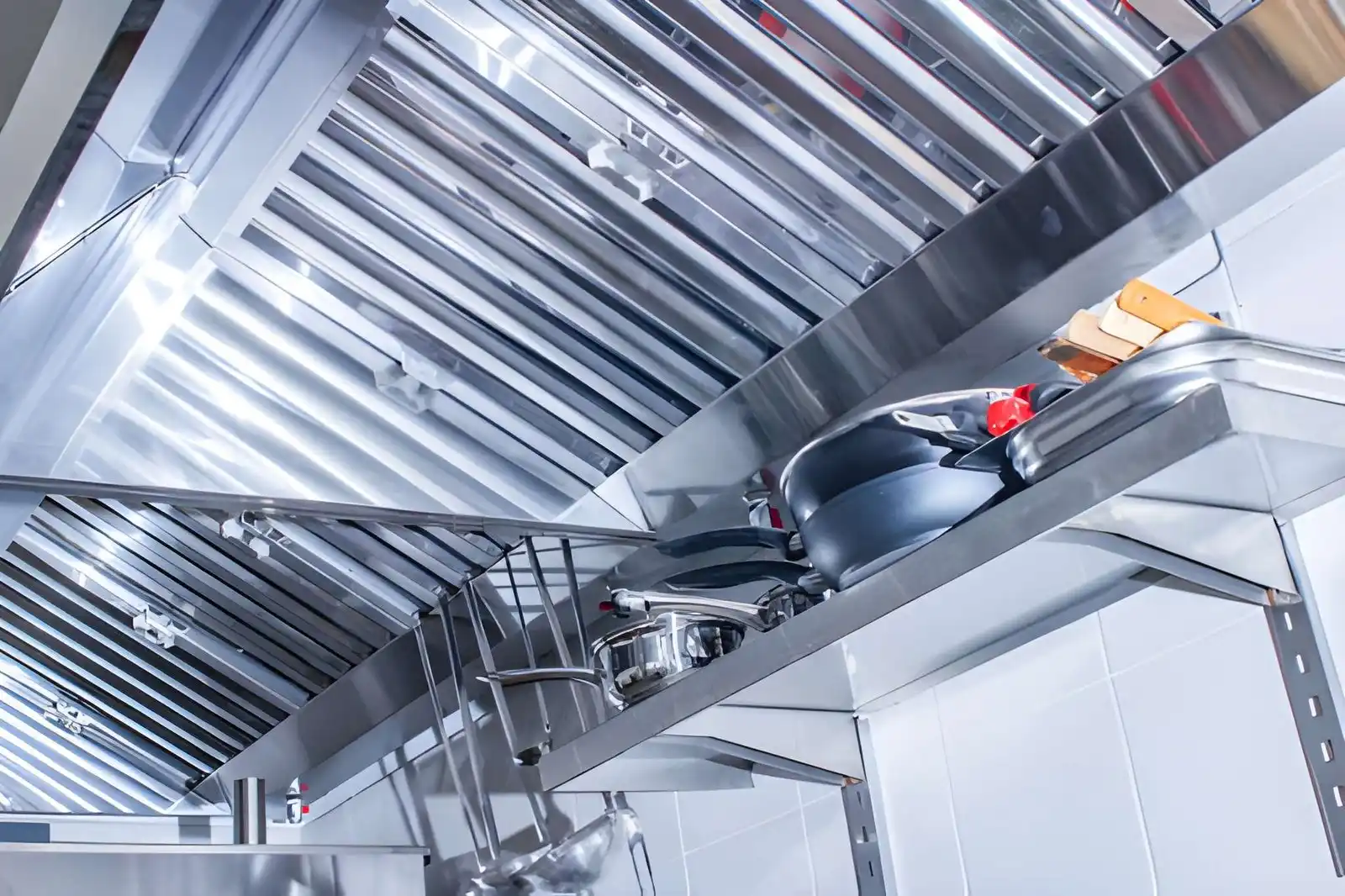 Commercial Hood Kitchen Repair and Installation in Malibu showing professional technicians installing a commercial kitchen hood system in a coastal restaurant setting